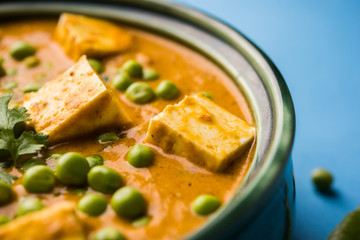 Green peas or matar paneer curry recipe, served in a bowl. selective focus