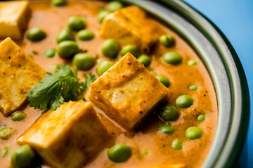 Green peas or matar paneer curry recipe, served in a bowl. selective focus