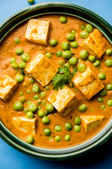 Green peas or matar paneer curry recipe, served in a bowl. selective focus