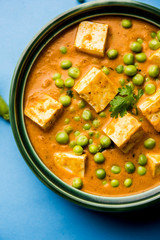 Green peas or matar paneer curry recipe, served in a bowl. selective focus