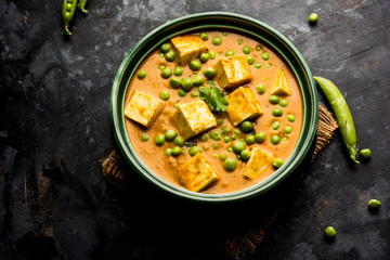 Green peas or matar paneer curry recipe, served in a bowl. selective focus