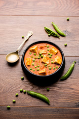 Green peas or matar paneer curry recipe, served in a bowl. selective focus