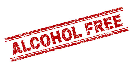 ALCOHOL FREE seal print with corroded style. Red vector rubber print of ALCOHOL FREE title with retro texture. Text title is placed between double parallel lines.