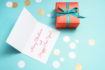 Decorated boxes, confetti and Christmas greeting card.