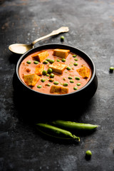 Green peas or matar paneer curry recipe, served in a bowl. selective focus