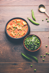Green peas or matar paneer curry recipe, served in a bowl. selective focus