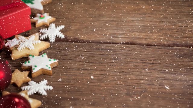 Falling snow with Christmas cookies decoration