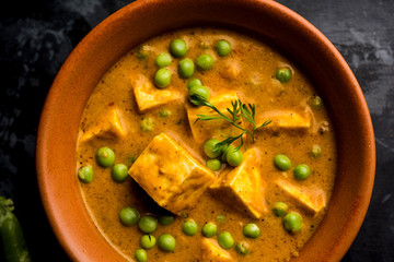 Green peas or matar paneer curry recipe, served in a bowl. selective focus