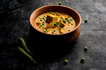 Green peas or matar paneer curry recipe, served in a bowl. selective focus
