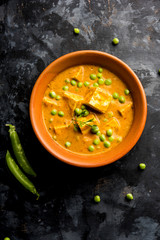 Green peas or matar paneer curry recipe, served in a bowl. selective focus