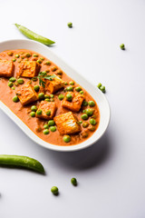 Green peas or matar paneer curry recipe, served in a bowl. selective focus