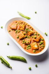 Green peas or matar paneer curry recipe, served in a bowl. selective focus