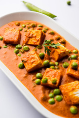 Green peas or matar paneer curry recipe, served in a bowl. selective focus