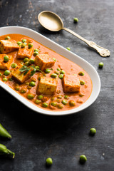 Green peas or matar paneer curry recipe, served in a bowl. selective focus