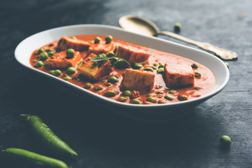 Green peas or matar paneer curry recipe, served in a bowl. selective focus