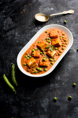 Green peas or matar paneer curry recipe, served in a bowl. selective focus