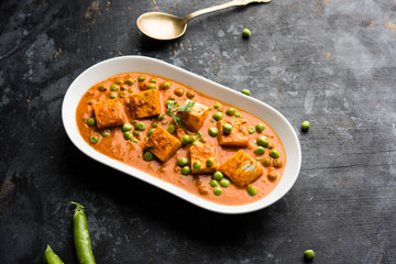 Green peas or matar paneer curry recipe, served in a bowl. selective focus