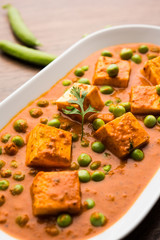 Green peas or matar paneer curry recipe, served in a bowl. selective focus