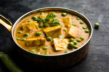 Green peas or matar paneer curry recipe, served in a bowl. selective focus