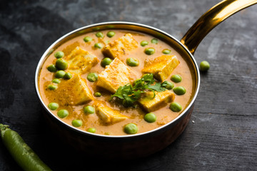 Green peas or matar paneer curry recipe, served in a bowl. selective focus