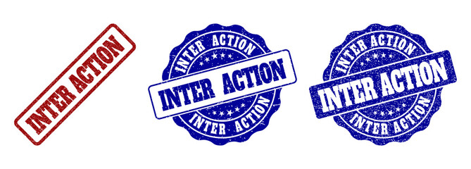 Fototapeta premium INTER ACTION grunge stamp seals in red and blue colors. Vector INTER ACTION imprints with grunge effect. Graphic elements are rounded rectangles, rosettes, circles and text tags.