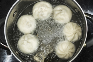 delicious dumplings are cooked in a saucepan