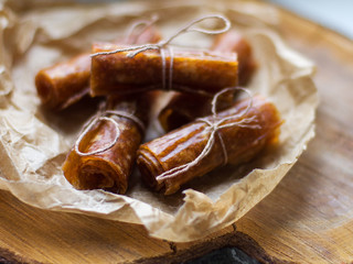 Apple candy close up on a paper napkin and wooden background with a soft blur effect