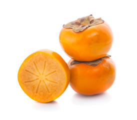 Tropical fruit persimmon. Kaki with leaves on white background.