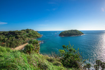 Fototapeta na wymiar Promthep Cape, Phuket is one of the most beautiful scenic spots in Phuket, with a wide range of tourists, scenic mountains, sea and blue sky.