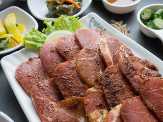 Set of slice raw pork ready to grill korean style, include slide food with vegetable and rice.