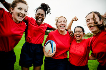 Cheerful rugby players celebrating their victory
