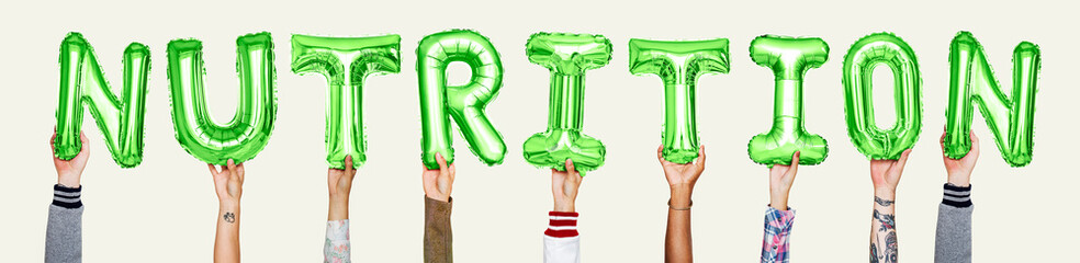 Hands holding nutrition word in balloon letters