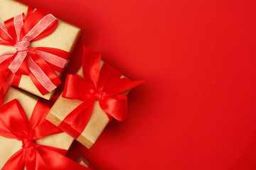 Wrapped presents with bright red background with copy space