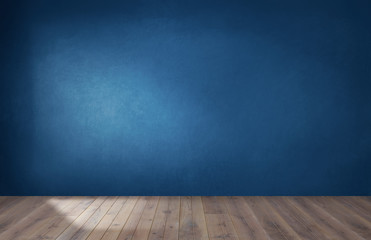 Dark blue wall in an empty room with a wooden floor