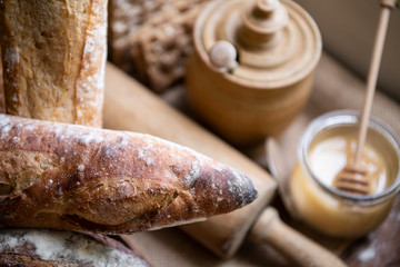 Homemade sourdough bread with a honey pot
