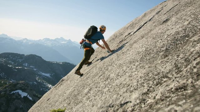 Confident male climber rock climbing Squamish Valley Canada