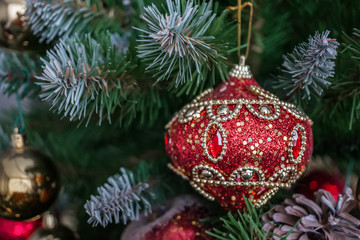 Beautiful Christmas decorations hanging on a Christmas tree. Home decoration for Christmas