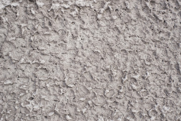 Naklejka premium The texture of the walls with plaster under a layer of cement, uneven cement wall coating