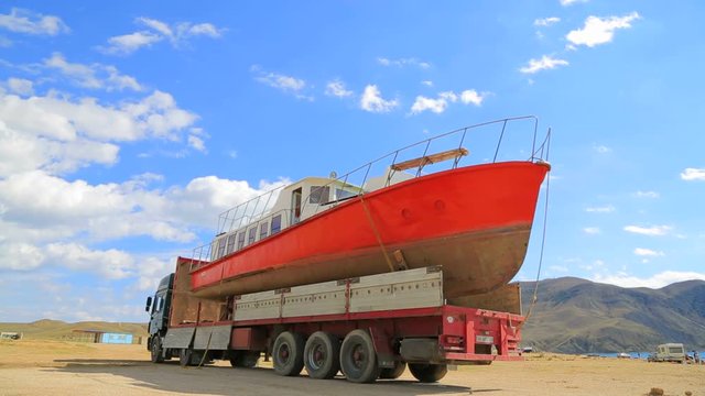 the red boat is ready for transport