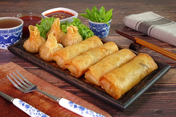 Spring rolls : Crispy deep fried spring rolls and wontons, famous Chinese appetizer.