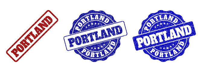 PORTLAND scratched stamp seals in red and blue colors. Vector PORTLAND marks with draft effect. Graphic elements are rounded rectangles, rosettes, circles and text labels.