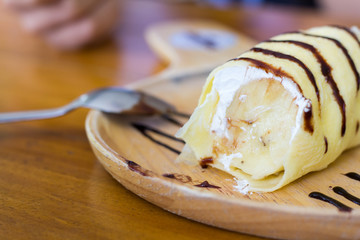 Abstract dessert banana on the wooden table. selective focus blurred in the other.