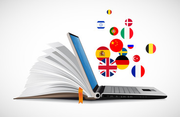 Laptop and book as online dictionary - e-learning online language learning system 