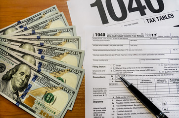 Tax form 1040, dollars, pen