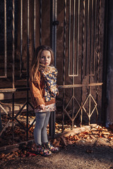 portrait of girl in front of a wall