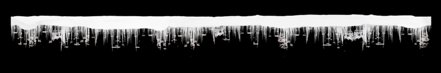 icicles and snow pattern isolated on black background