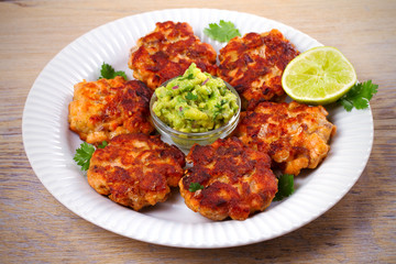 Salmon burgers with avocado salsa and lime. Salmon cakes. Fish patties. horizontal