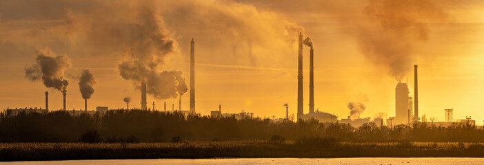 Smoking chemical plant chimneys,panorama.Air environment pollution concept.