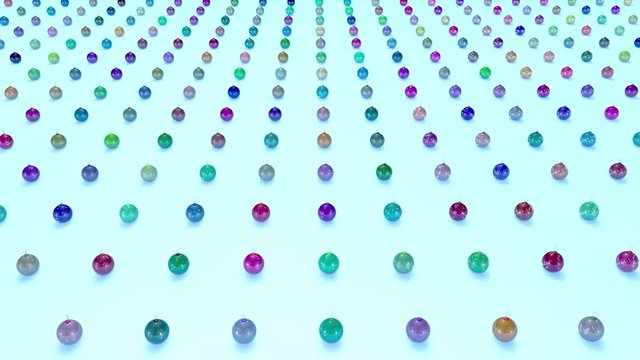 christmas balls on surface in a rows. 3d animation for new year compositions or background with depth of field. amera moves smoothly above the surface. Multi colored 3