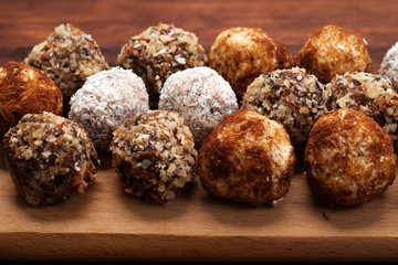 Hand-made sweets made from dried fruits, nuts and seeds (without sugar). Macro shooting. Shallow...